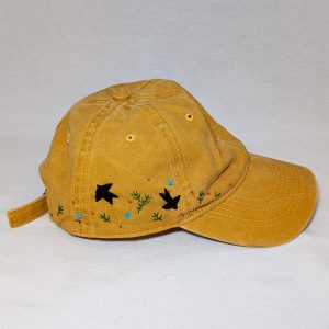 Gorra amarilla pájaros